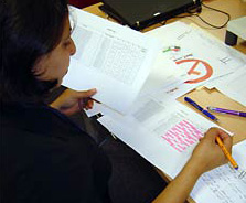 a teacher marking a student work sample